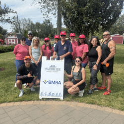 A photo of the BMRA team at the Willing Warriors event where BMRA is a Bronze Family Sponsor. The photo includes many employees from BMRA as well as the father-daughter Coyner duo of BMRA.
